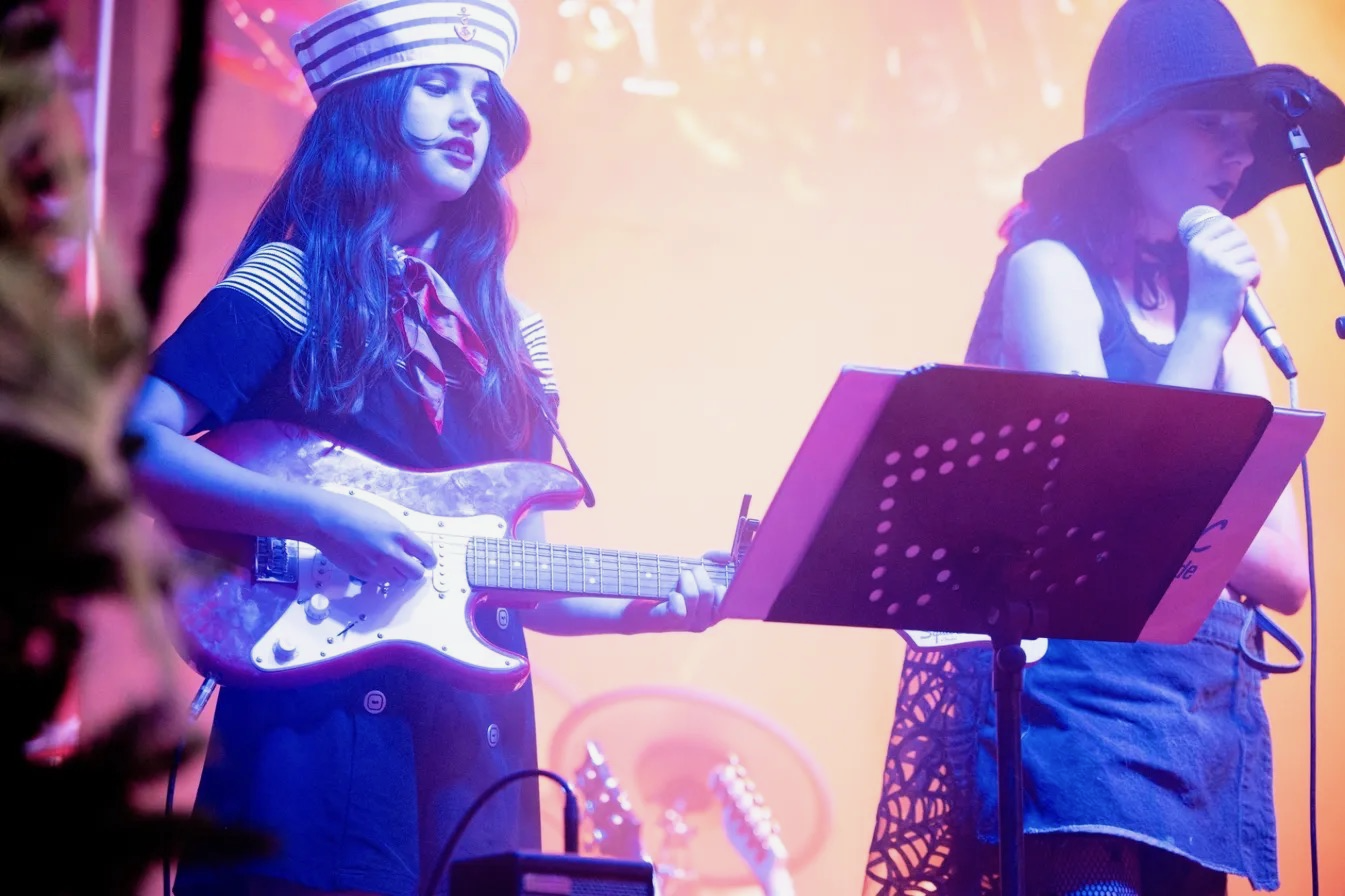 Students performing on stage