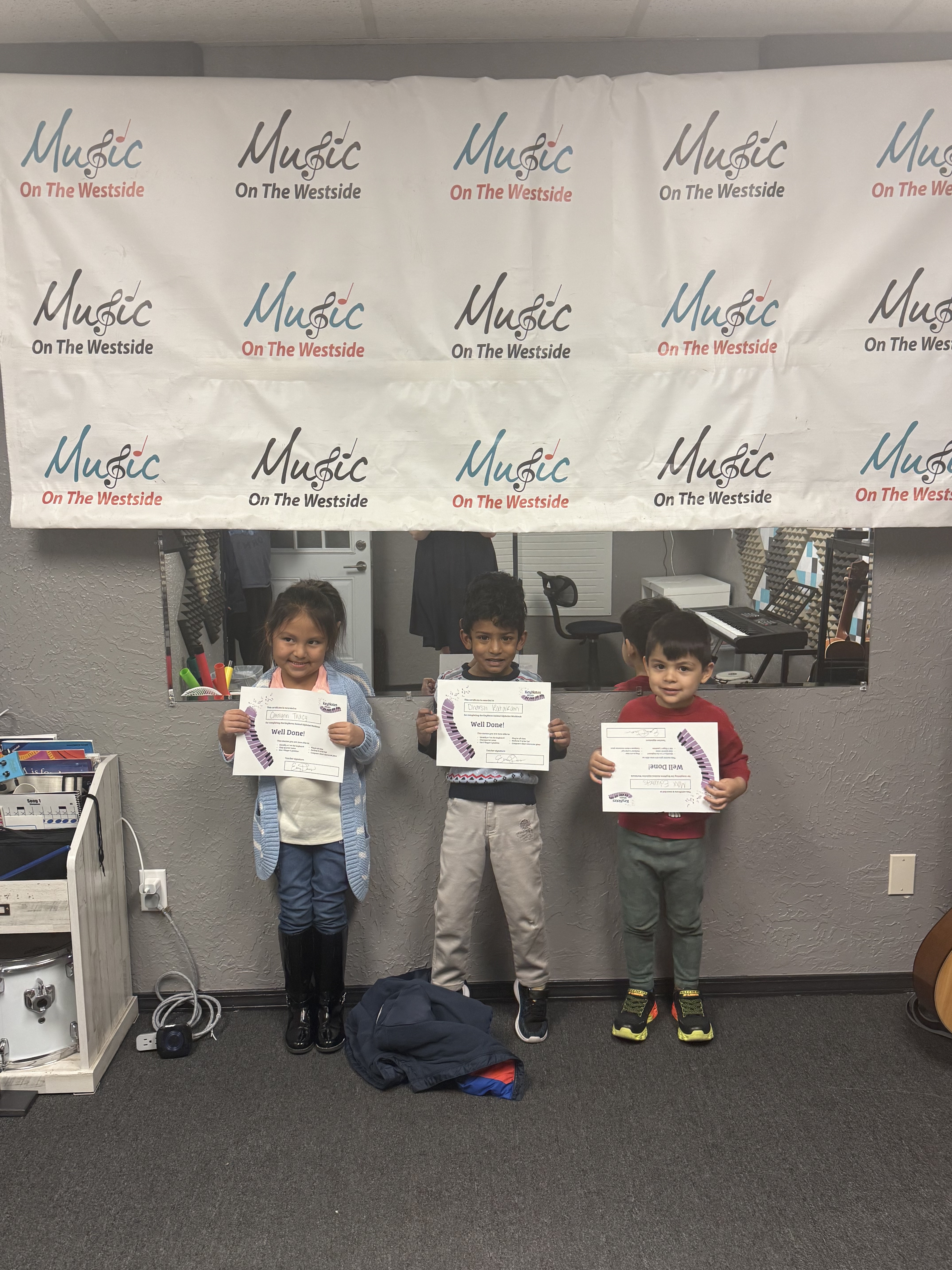 Rockin' Rookies students earning Well Done certificates